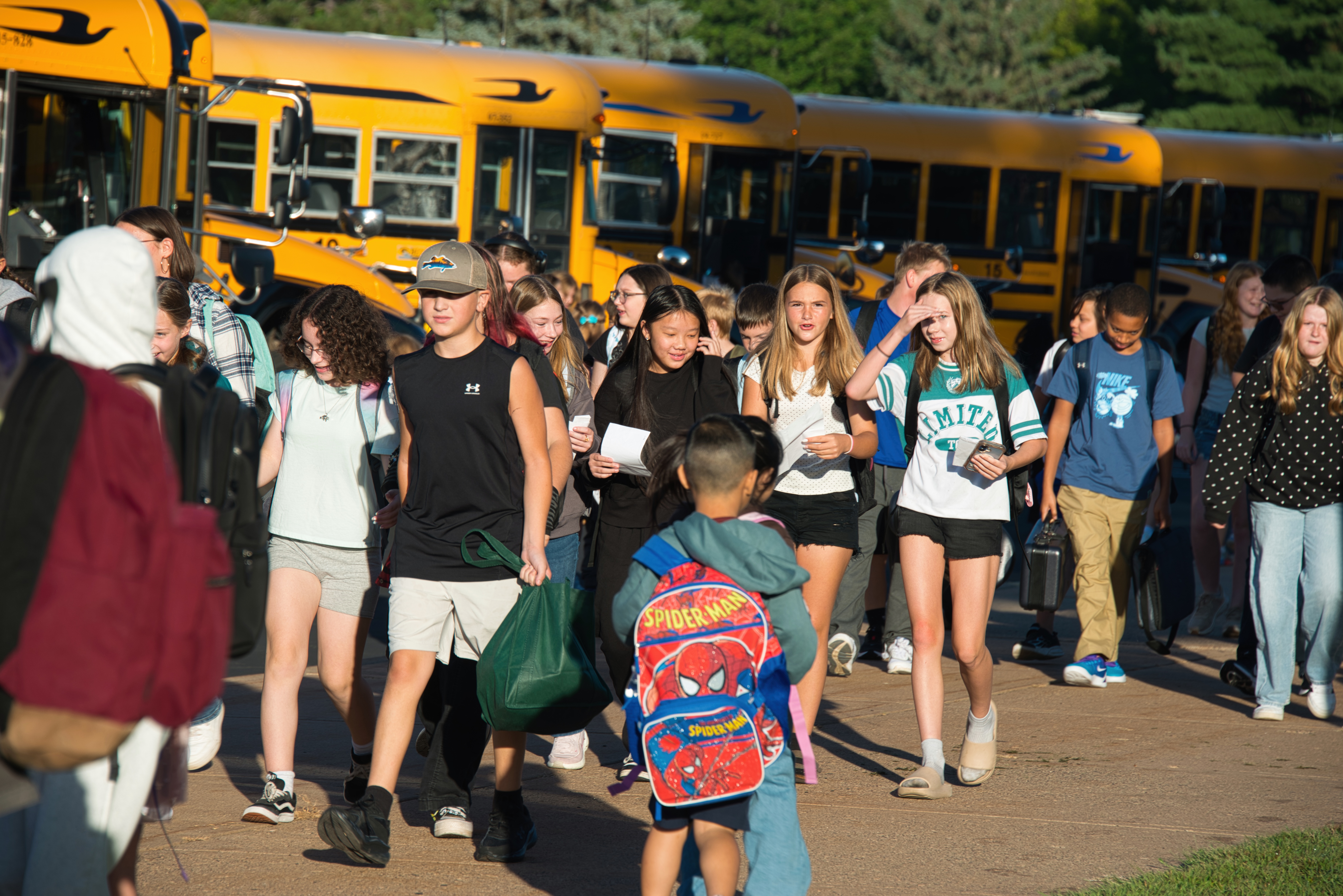 Middle school students arriving on the first day of school