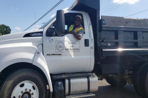 Town Public Works Employee in large dump truck