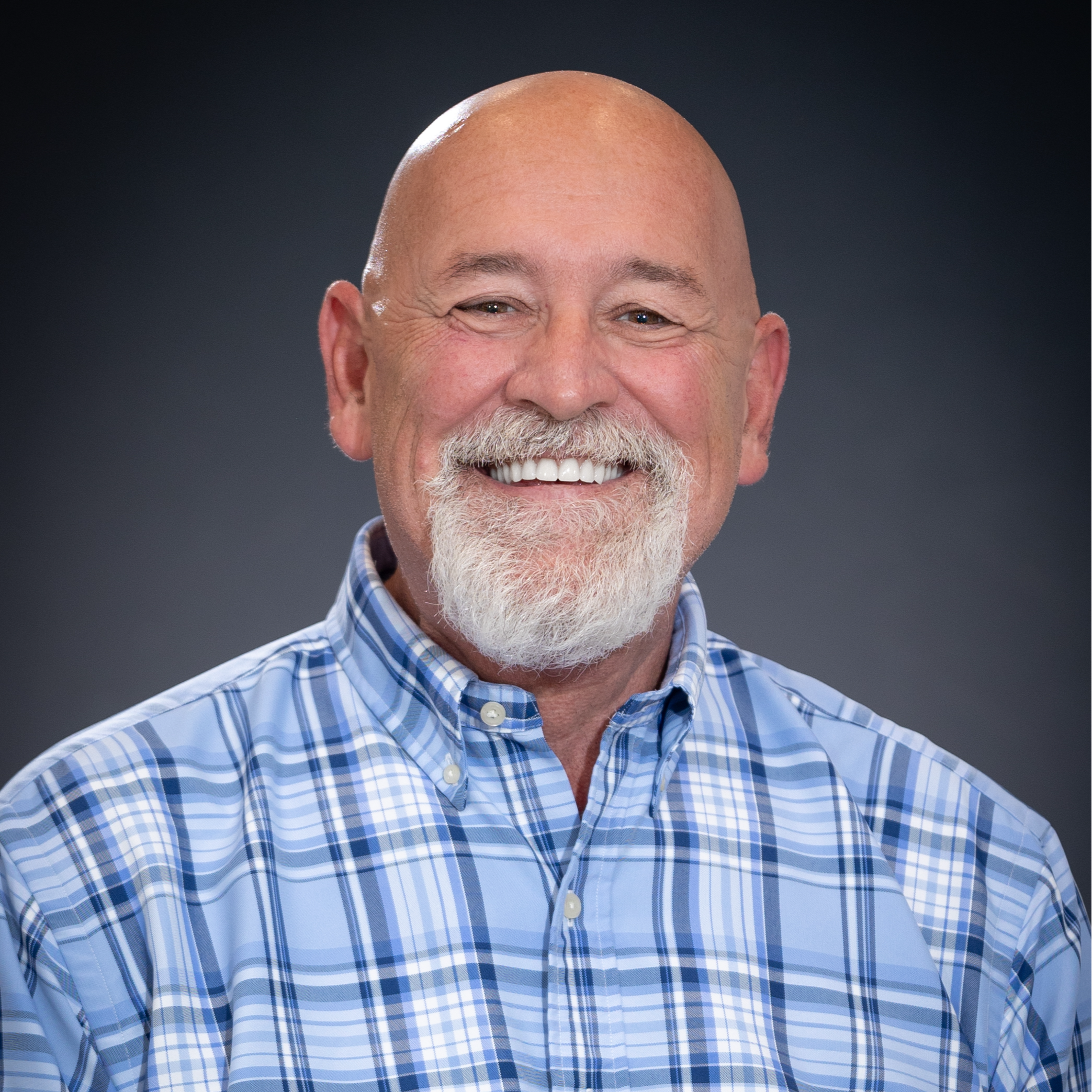 Headshot of Alderman Oscar Brooks in blue and white plaid shirt