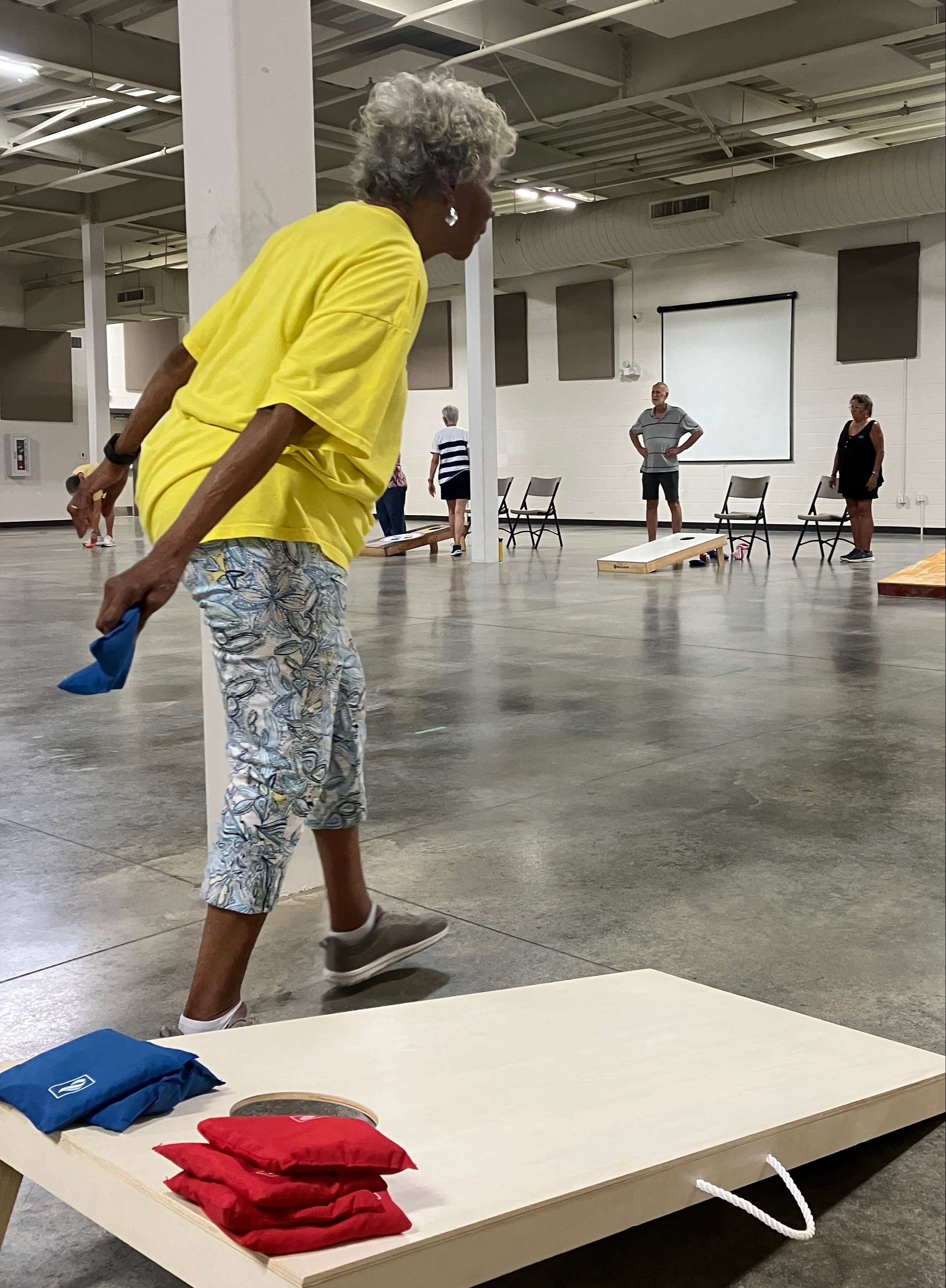 woman playing cornhole