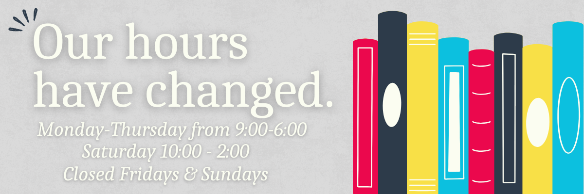 Note that Library Hours have changed beside a shelf of multi-colored books