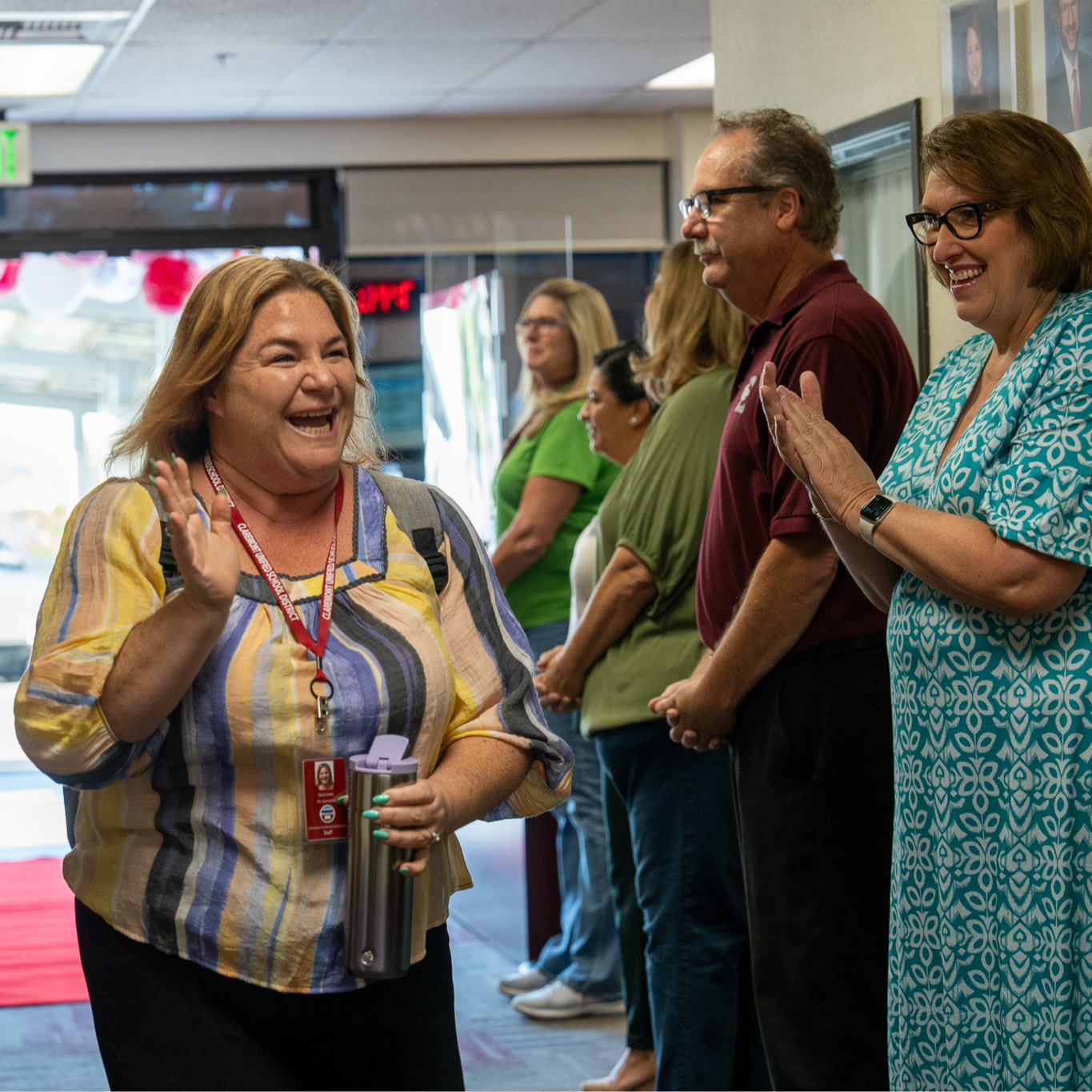 new teacher walking on the red carpet 