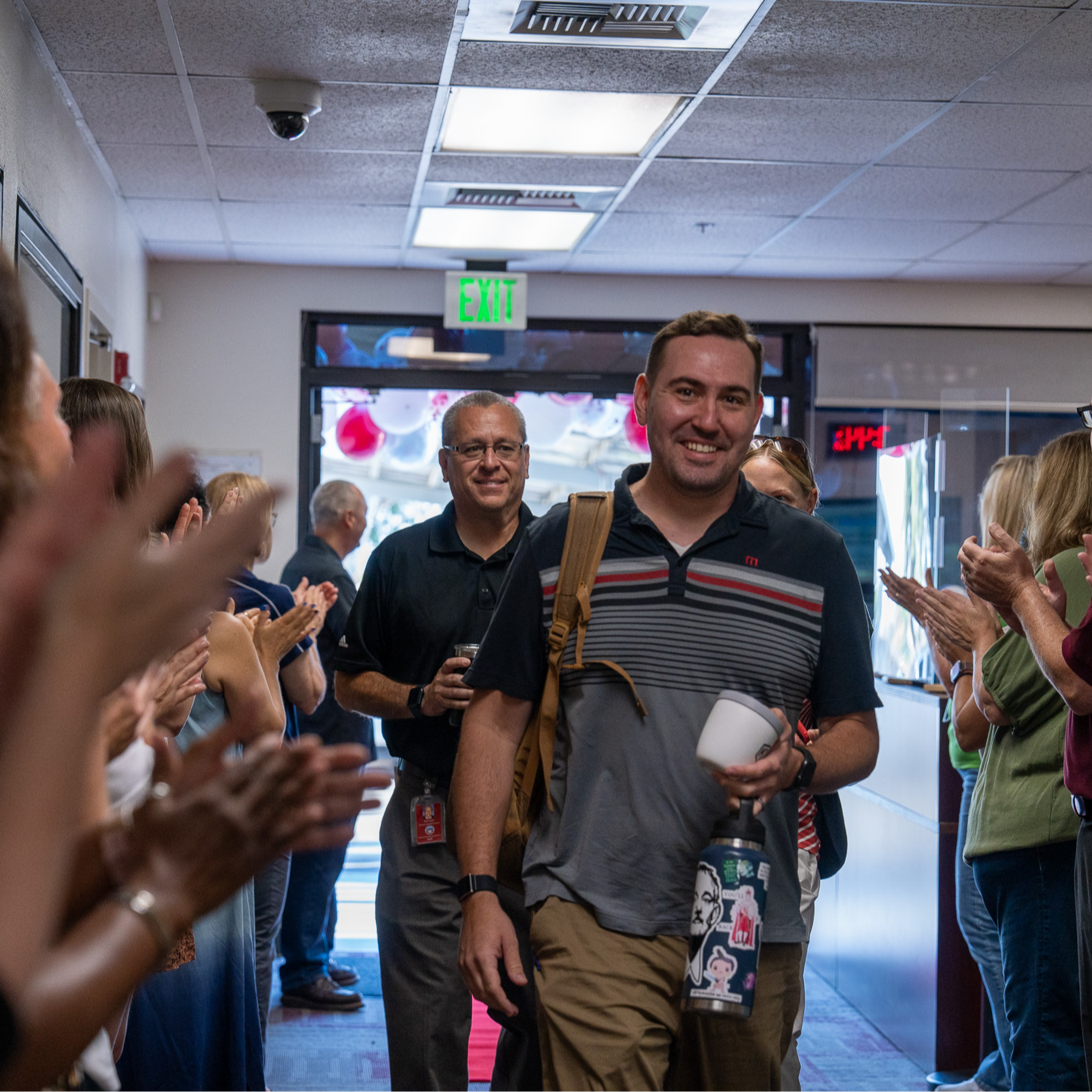 new teacher walking on the red carpet 