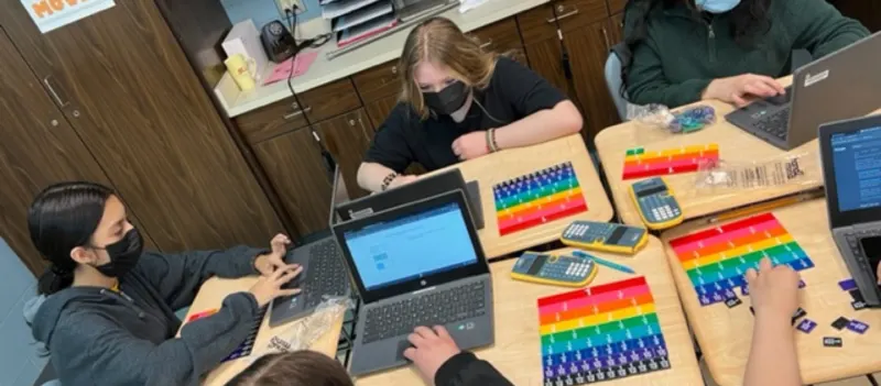 Students with laptops in class.jpg
