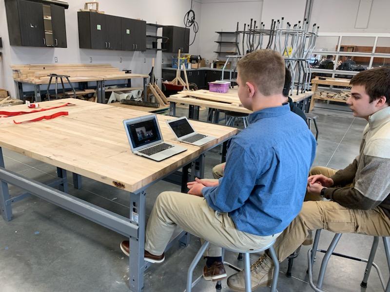 students looking at computer