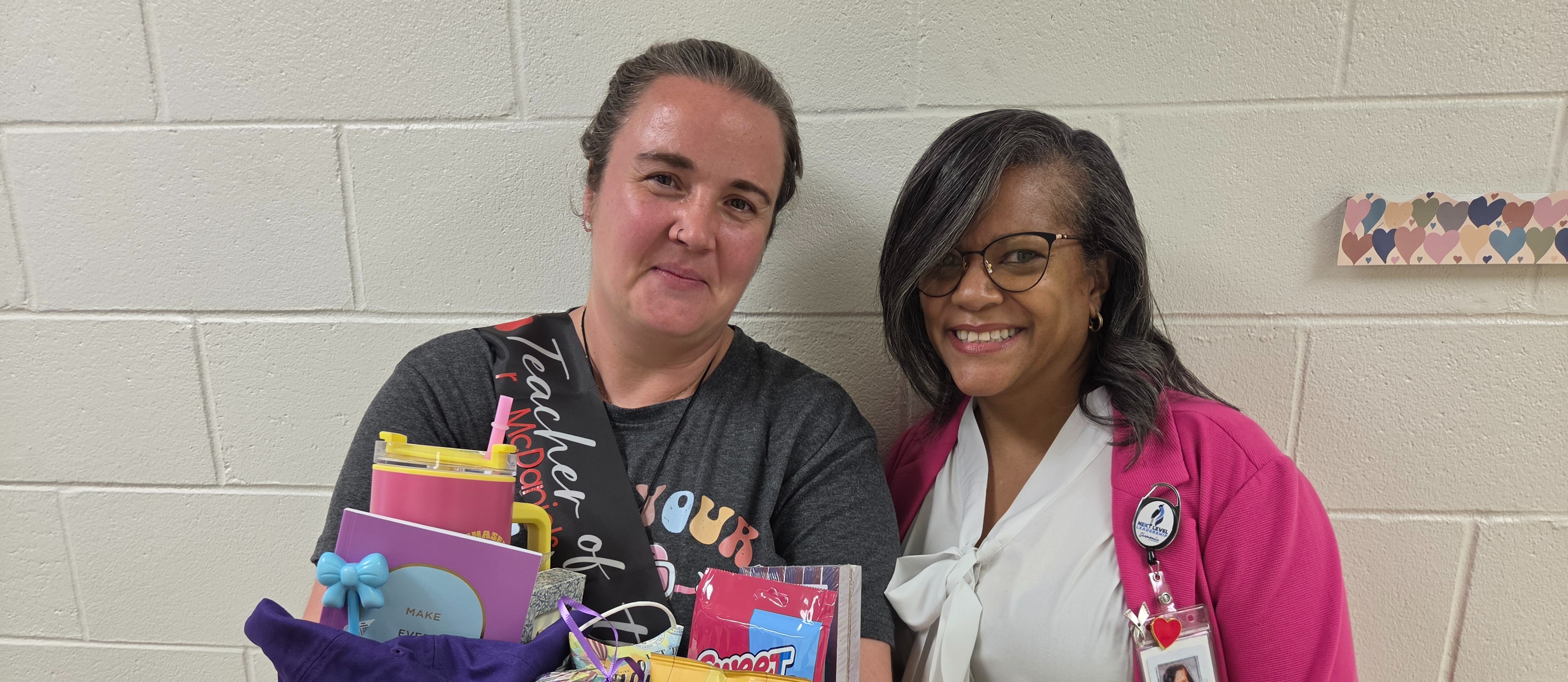 teacher of the year posing with the principal