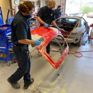 student repairing autopart