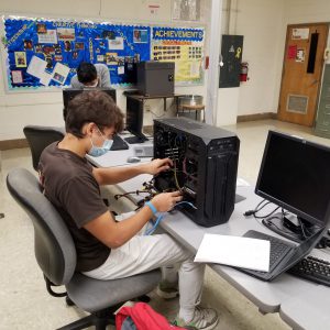 student in front of a computer