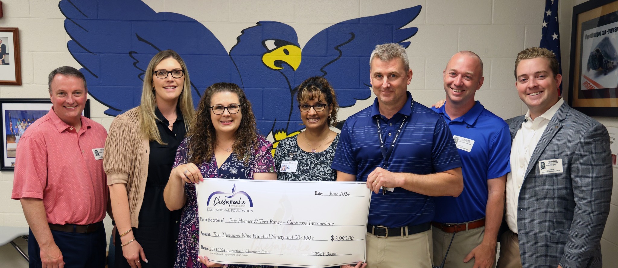 Teacher awarded a grant check at school