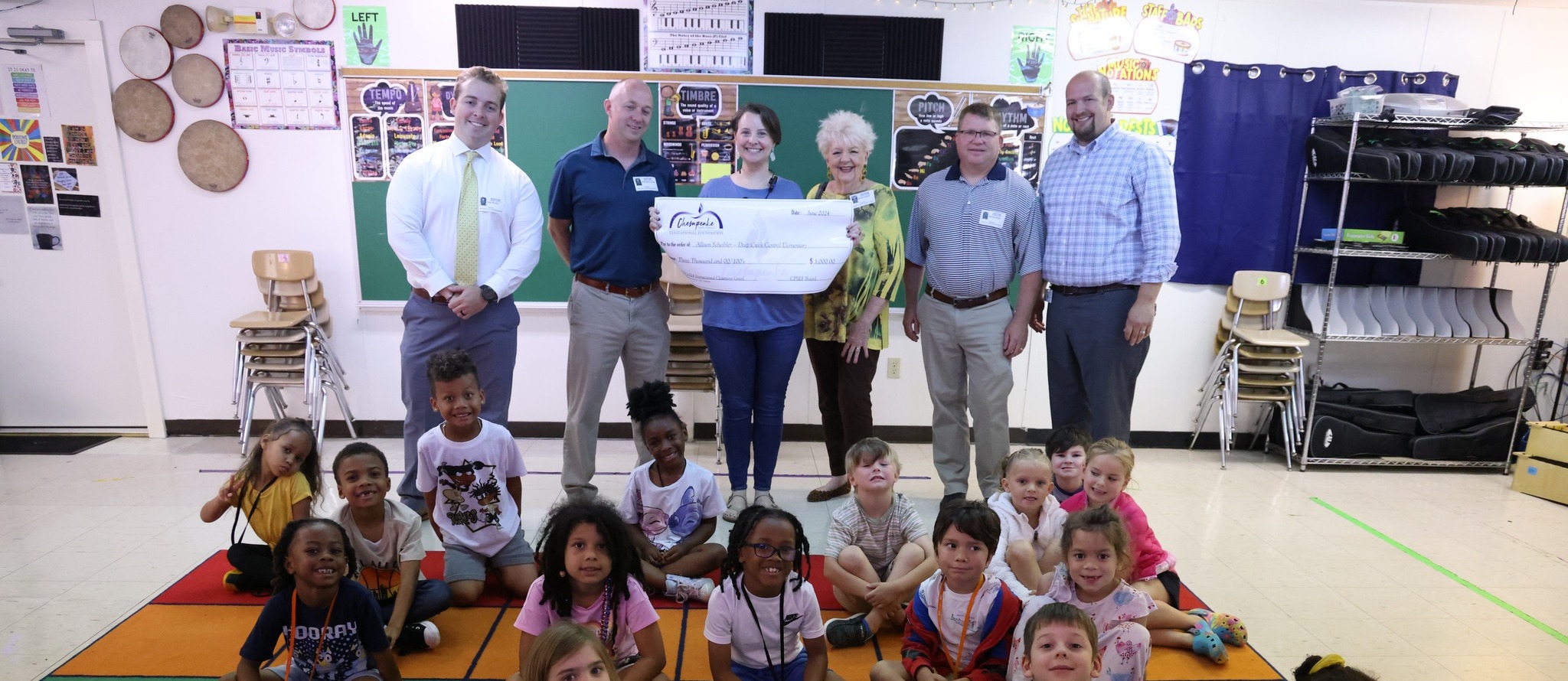 Teacher awarded a grant check at school