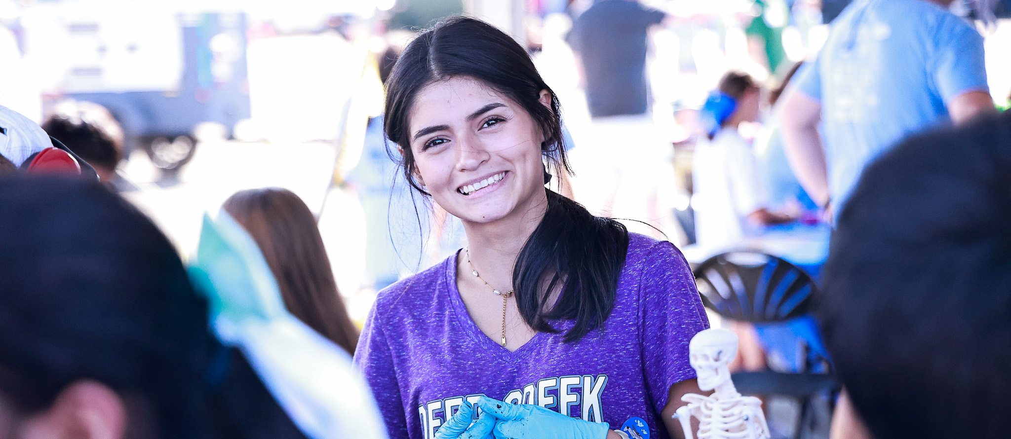 A DCHS SMA student smiles for a picture during the NAS Oceana Air Show STEM day