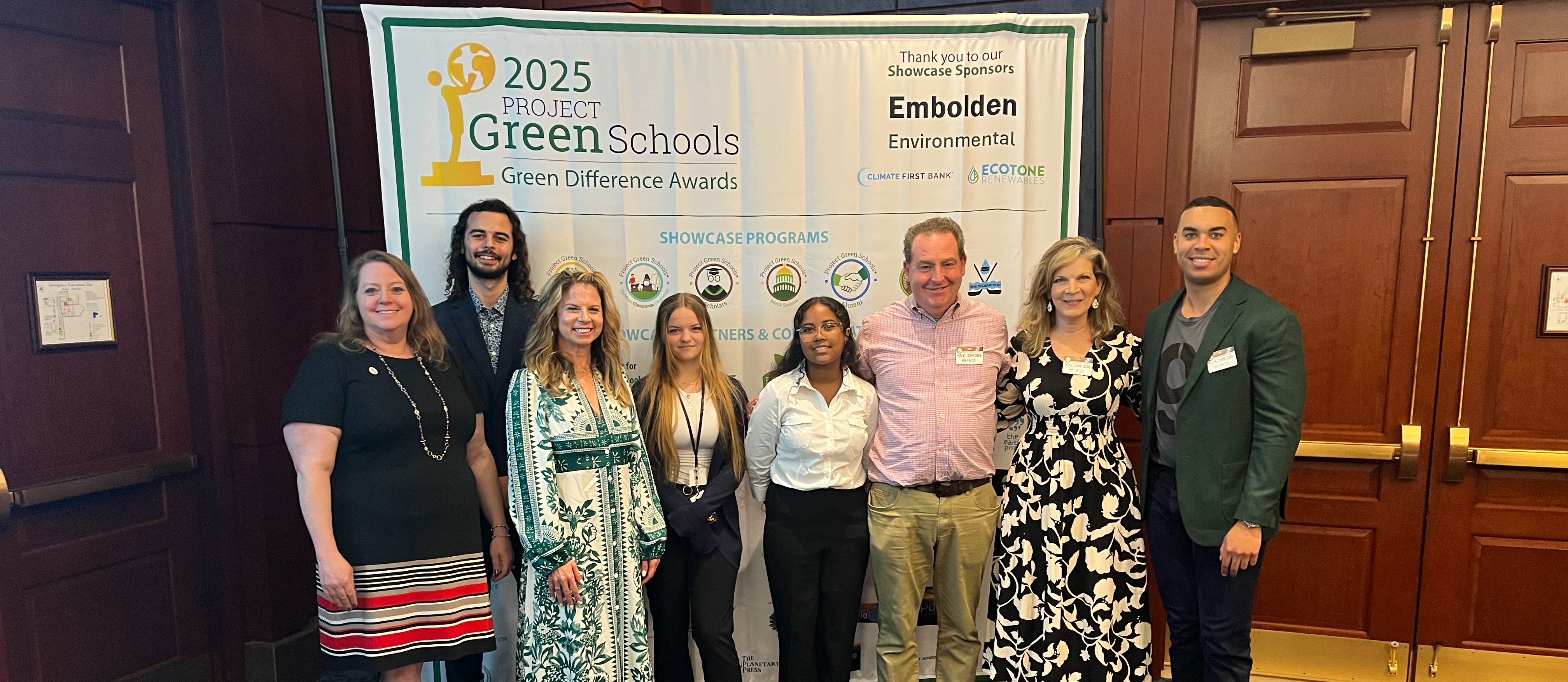Students receiving a green school award.