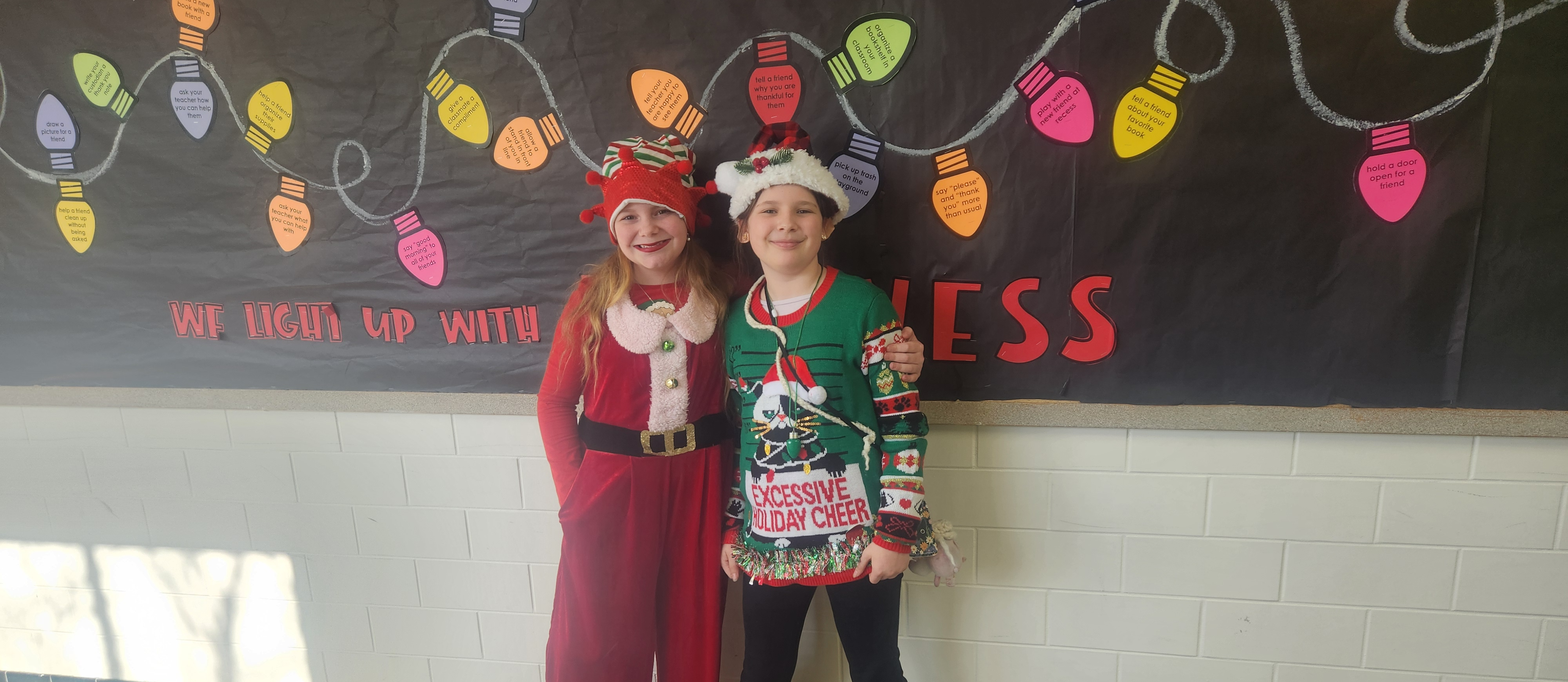 Two students dressed as elves