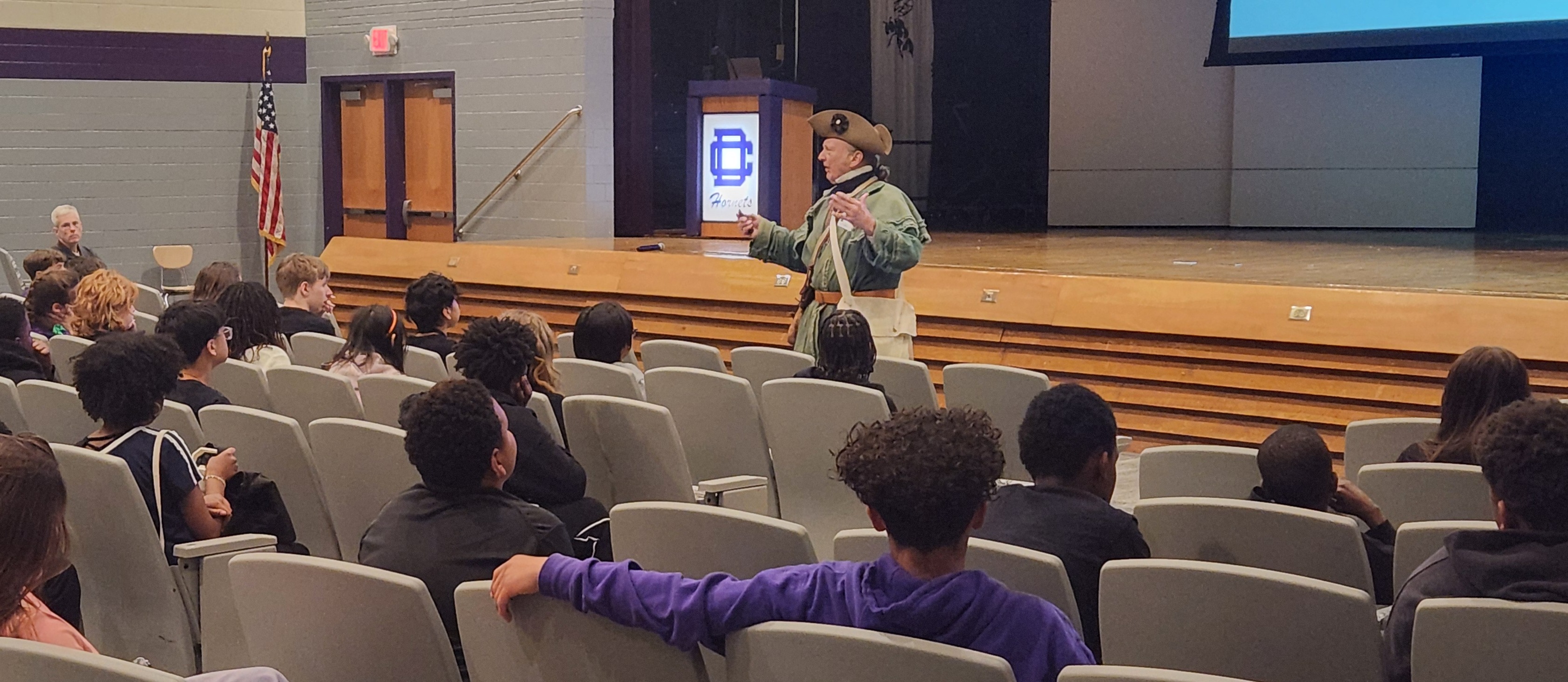 A revolutionary war re-enactor presenting the Battle of Great Bridge to seventh graders. 