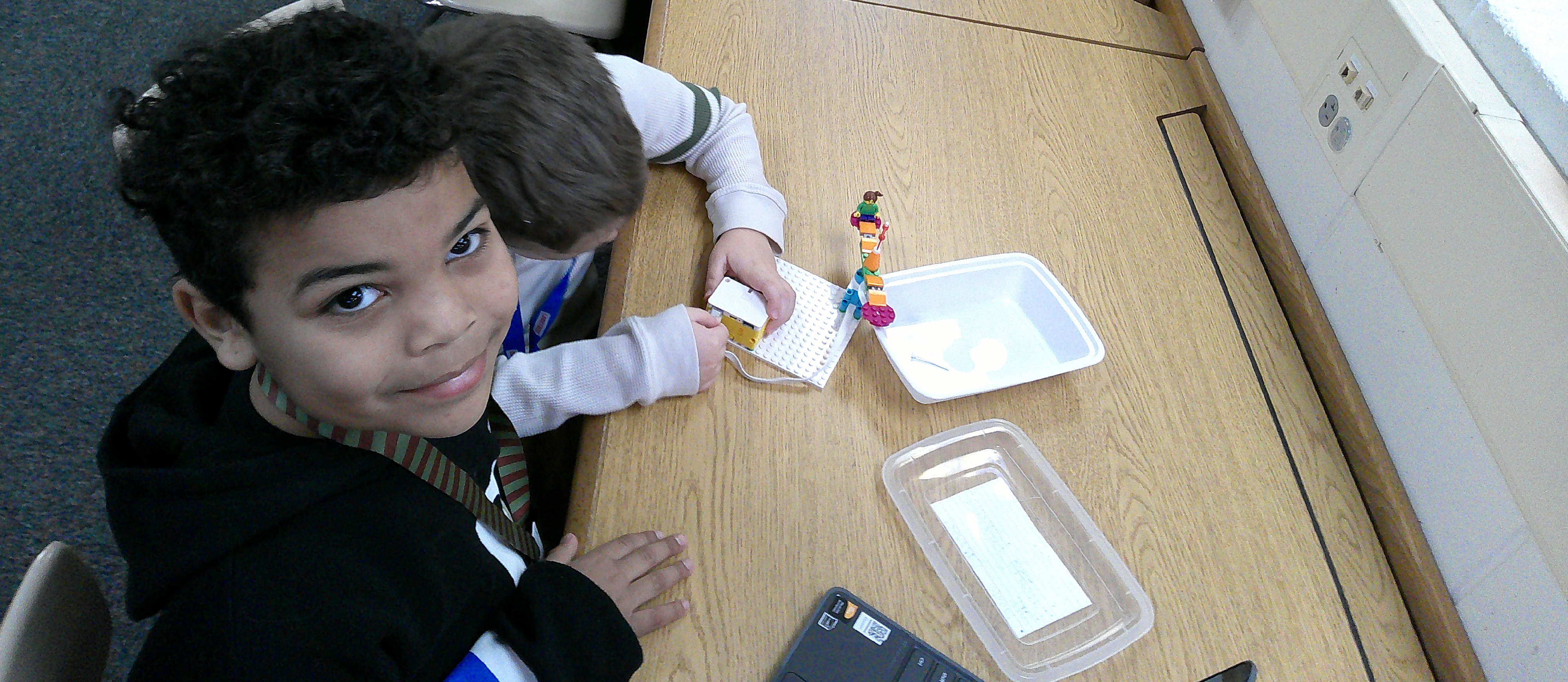 students building with Lego spike