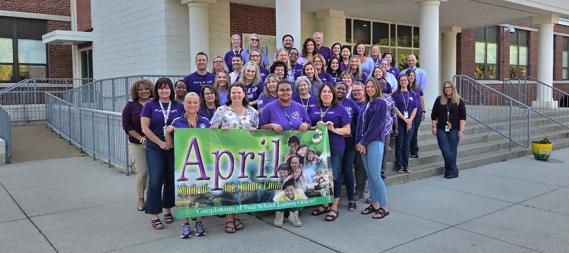 Teachers wearing purple in support of military children