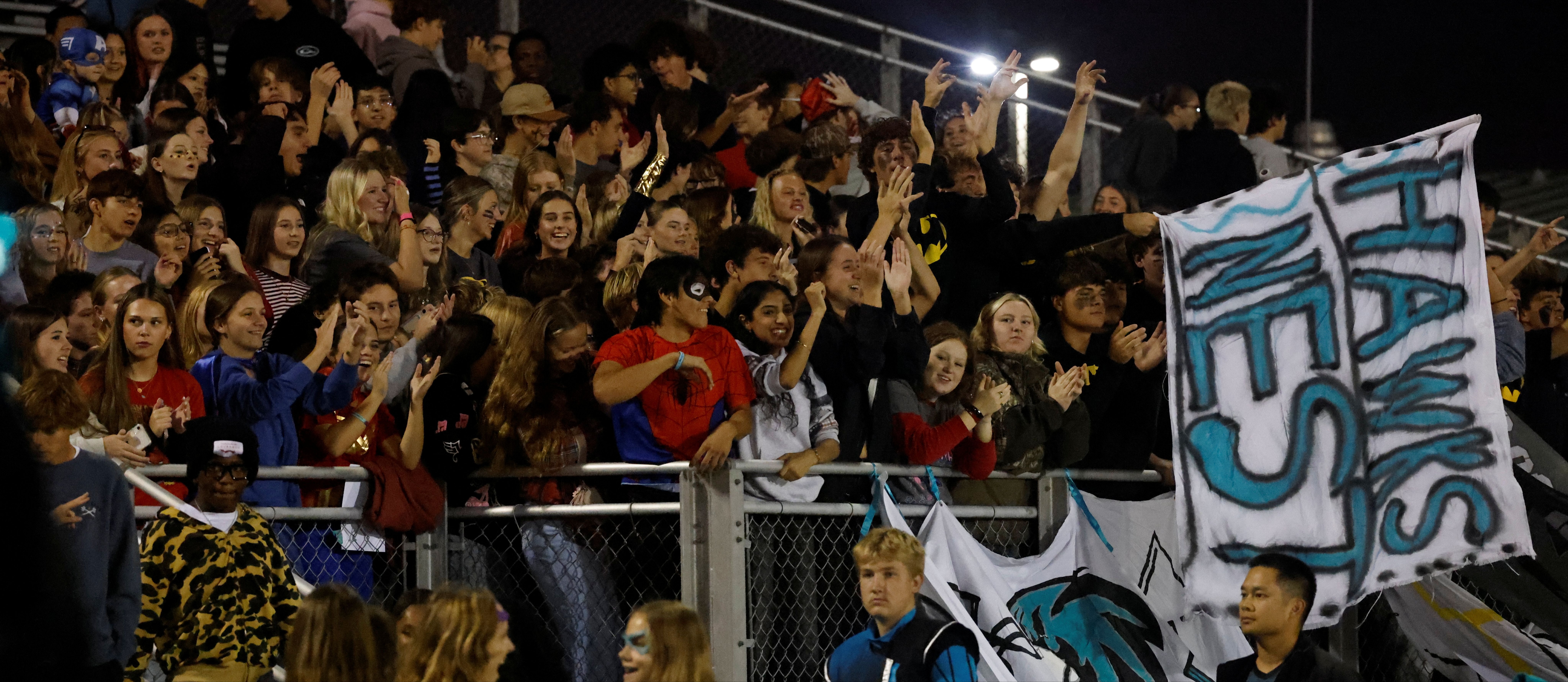 The Hickory High School "Hawks Nest" student section cheers on the football team during a game vs. Great Bridge