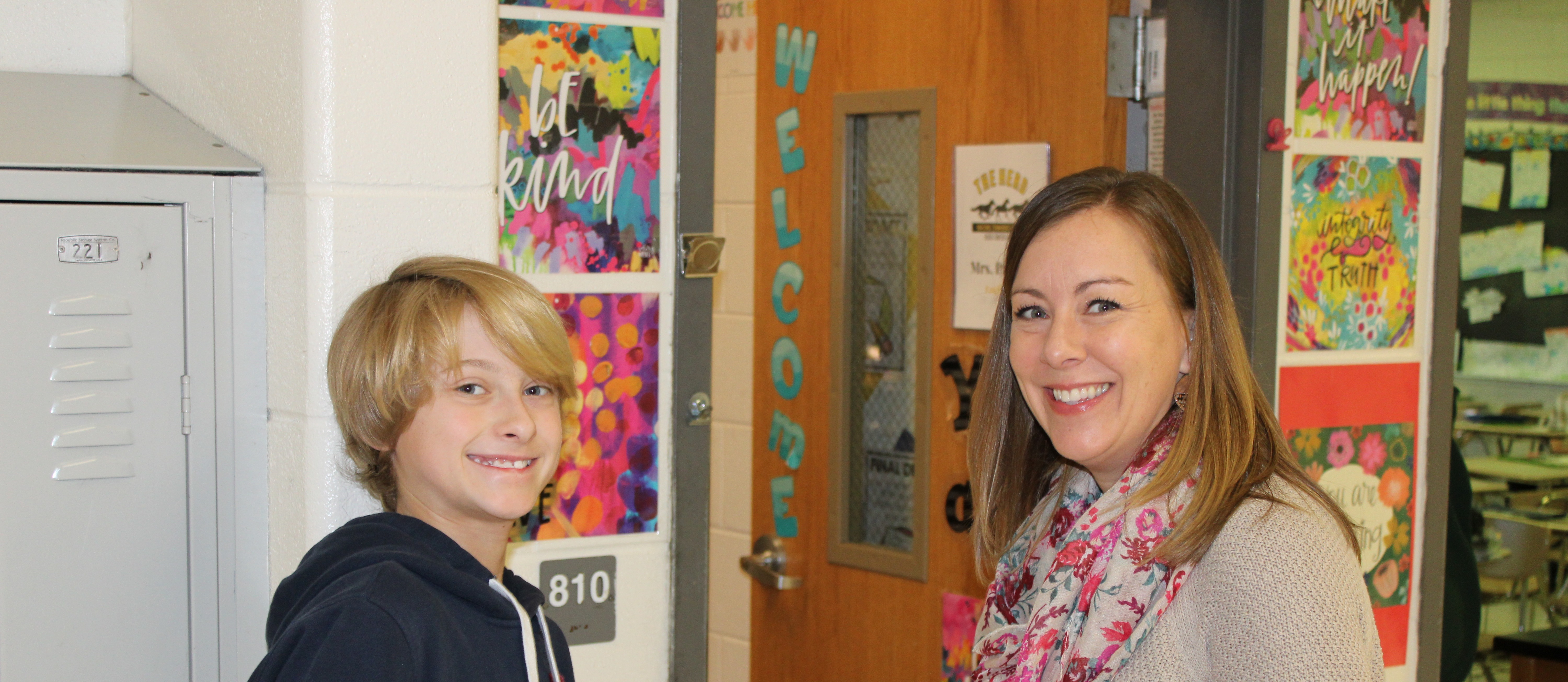 Teacher and student in hallway
