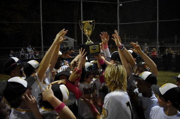 The Hugo Owens Middle School Baseball Team celebrates winning the CMSL Baseball Tournament