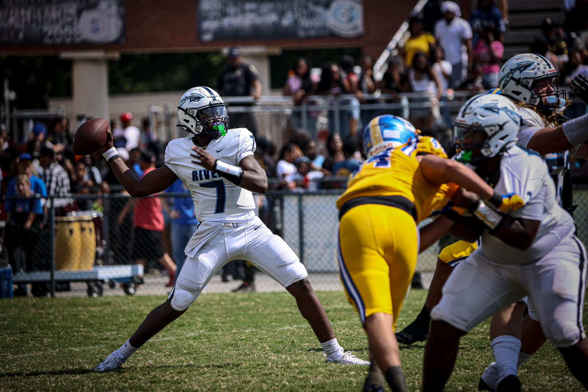 The IRHS Quarterback throws a pass against Oscar Smith