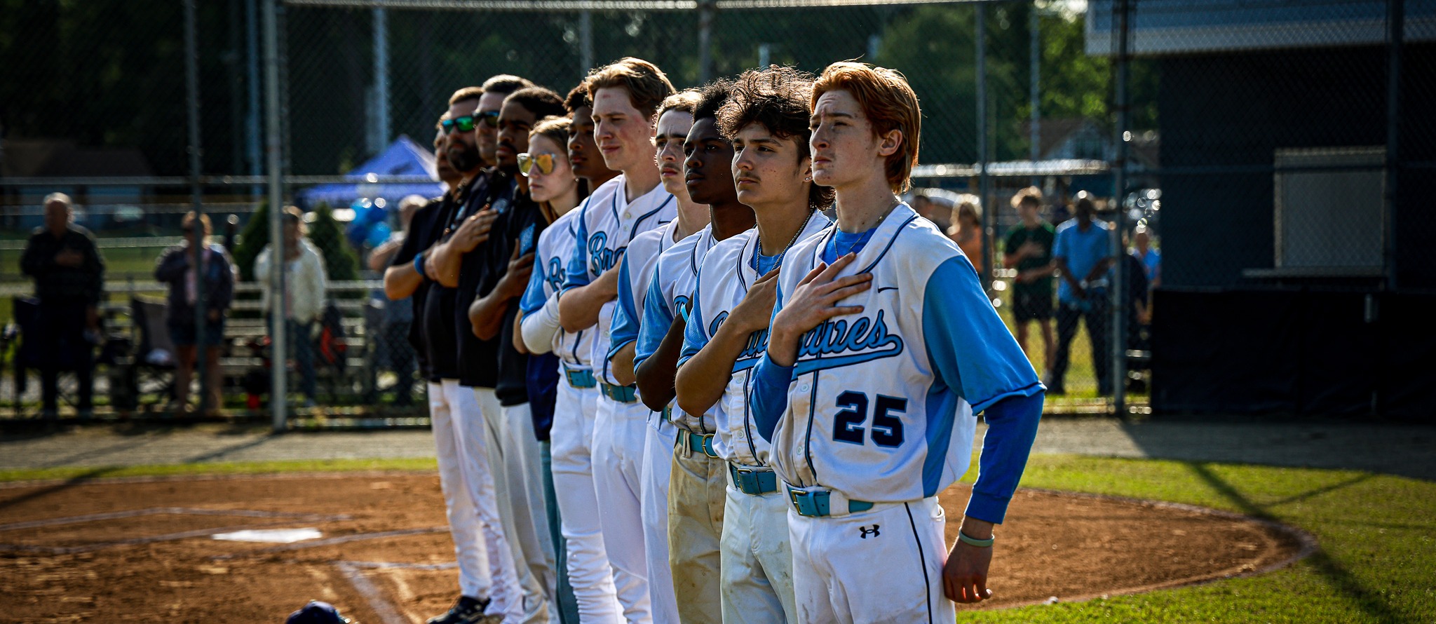 The IRHS baseball team lines up for the national anthem