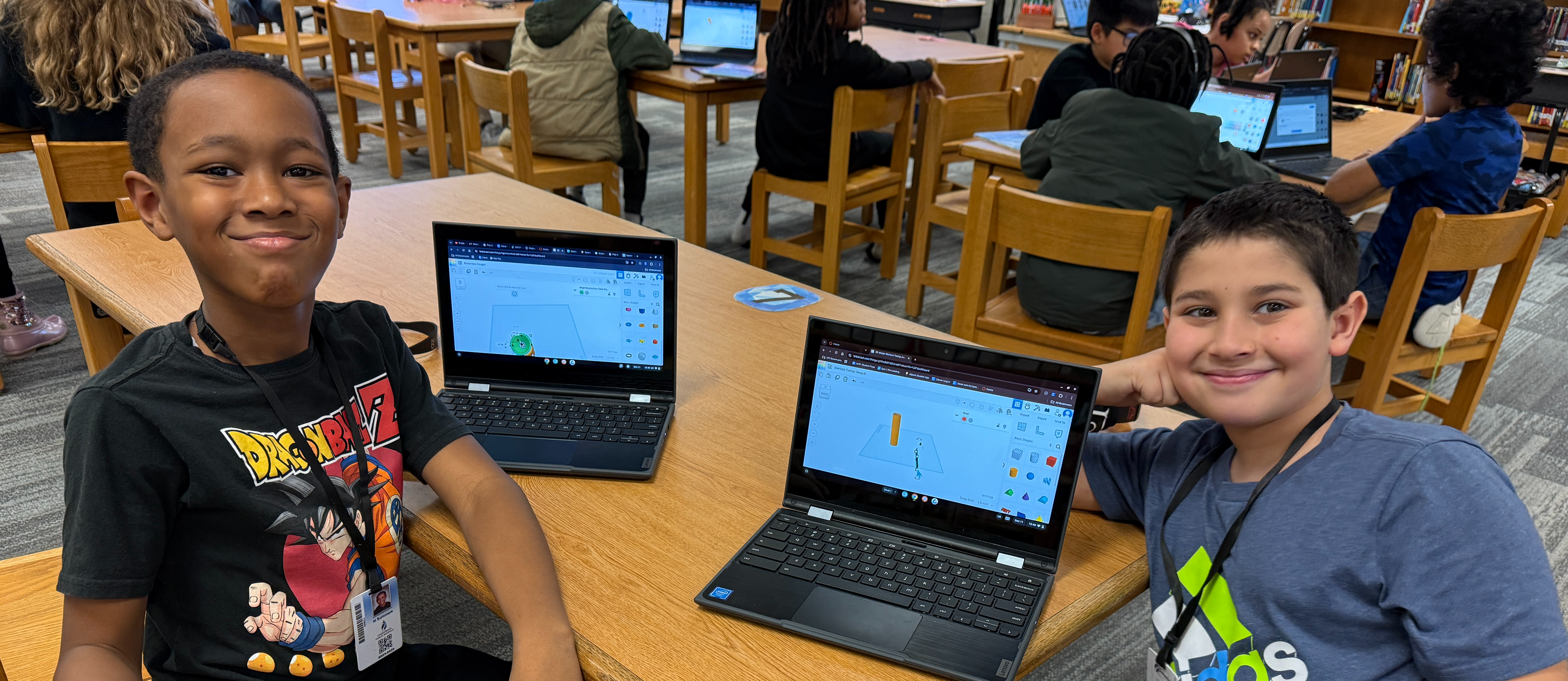 Two students with their chromebooks on Tinkercad