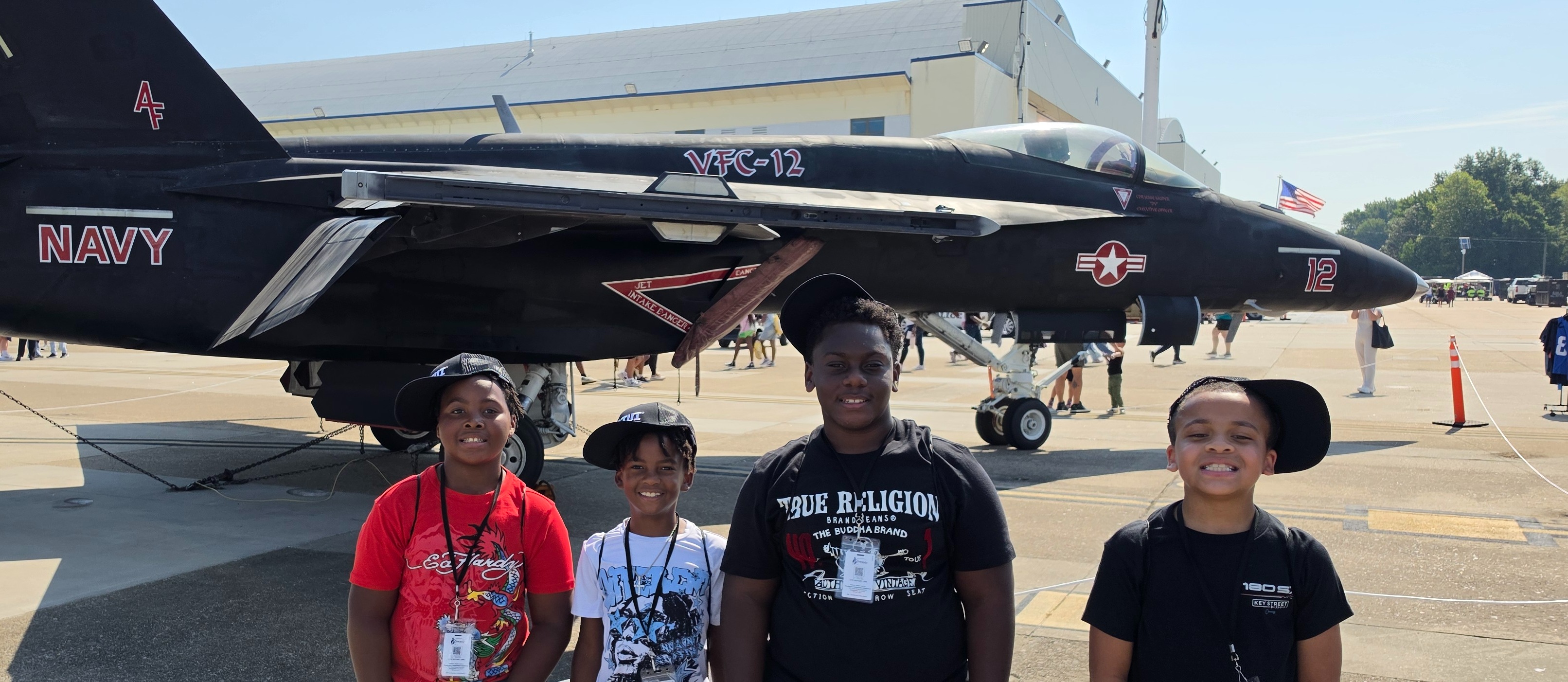 Truitt Intermediate 5th-graders pose for a picture in front of a NAVY jet while particpating in the NAS Ocean Field Trip