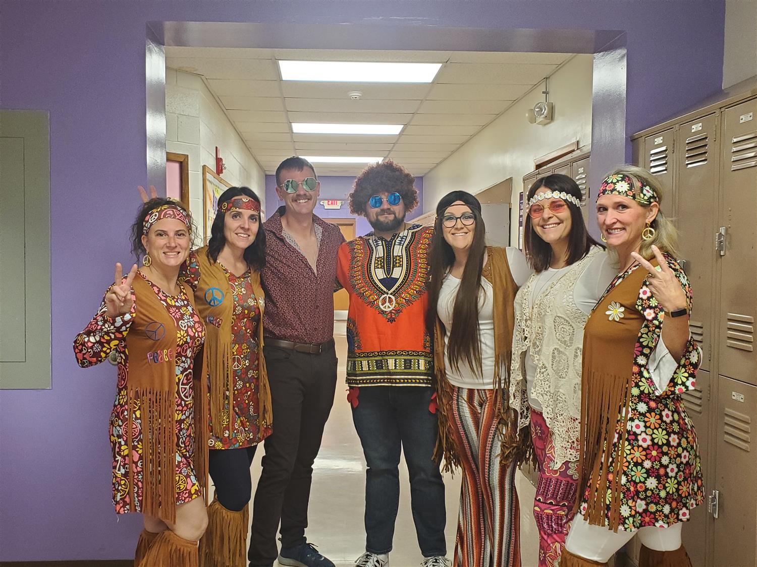 5 teachers dressed up like hippies