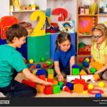 kids playing with primary colored blocks