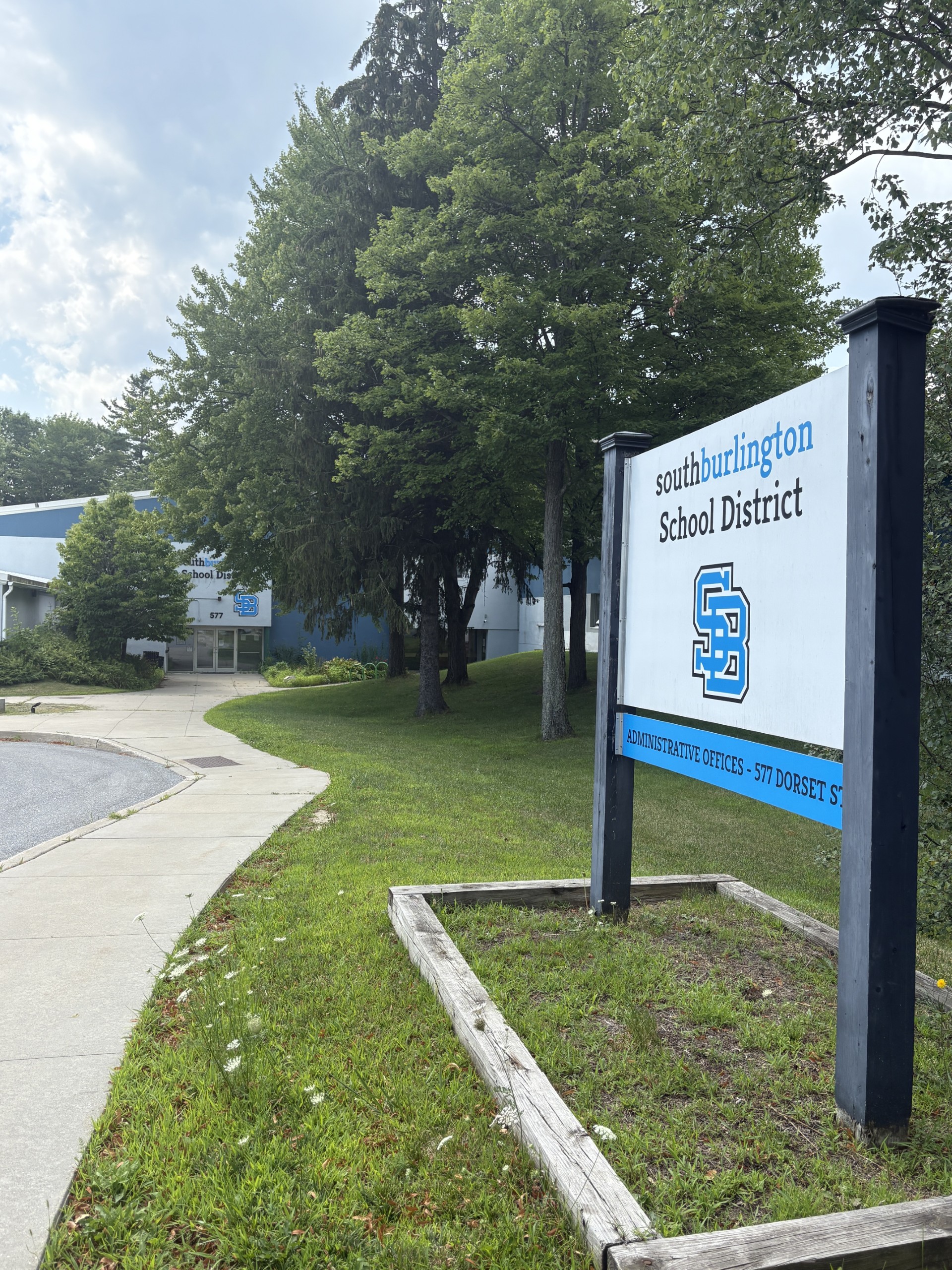 Sidewalk with building sign