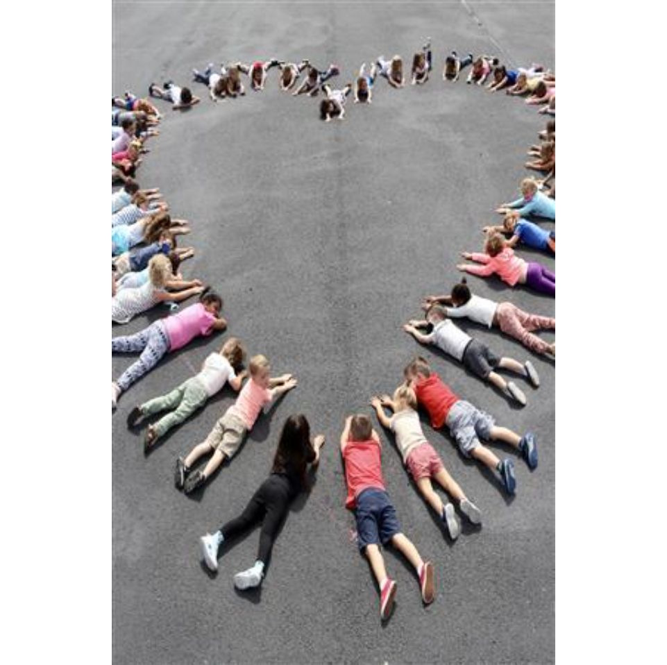 Students making a heart together