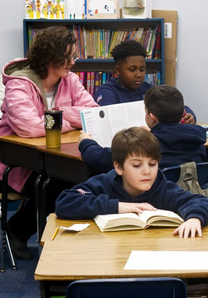 teacher and students reading