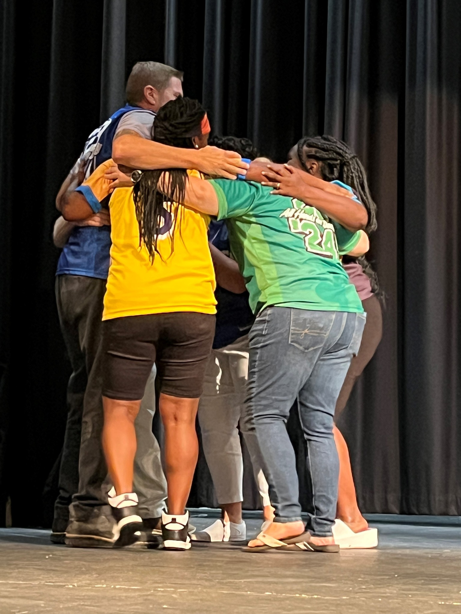 teachers huddled together