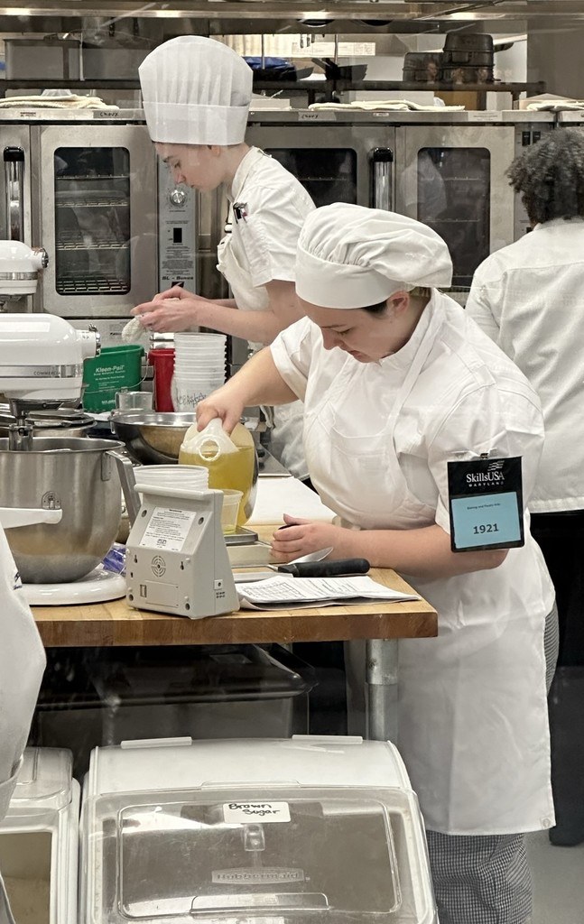 student mixing the ingredients for a cake
