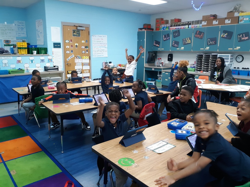 students listening to a teacher