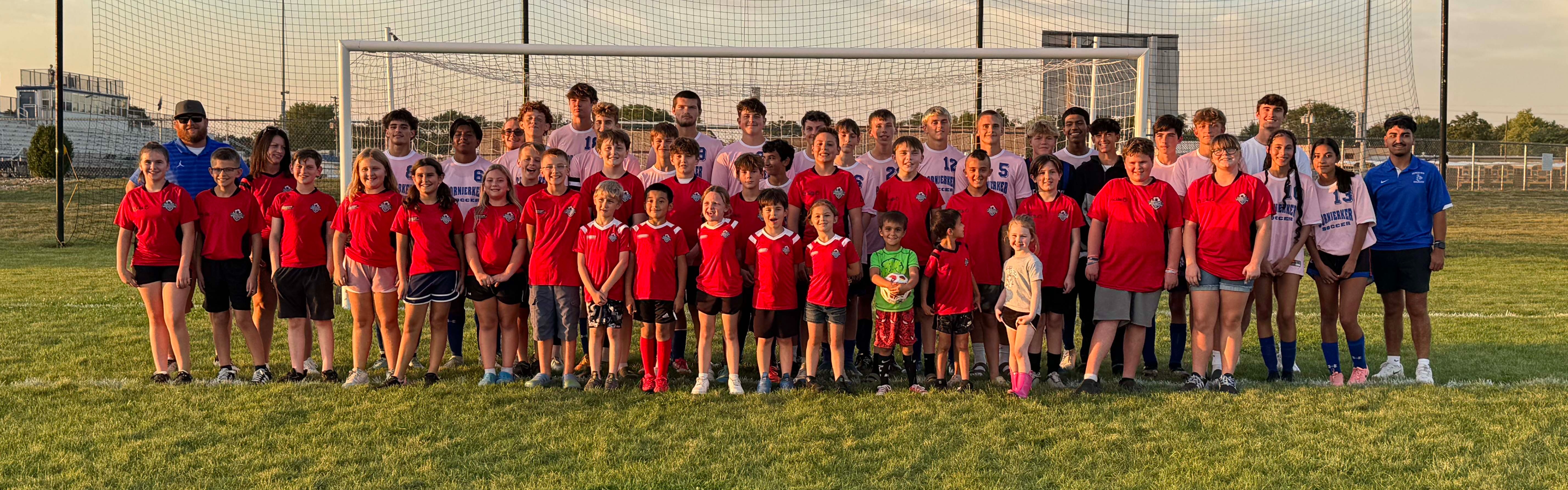 Youth soccer showing up for the Varsity game.