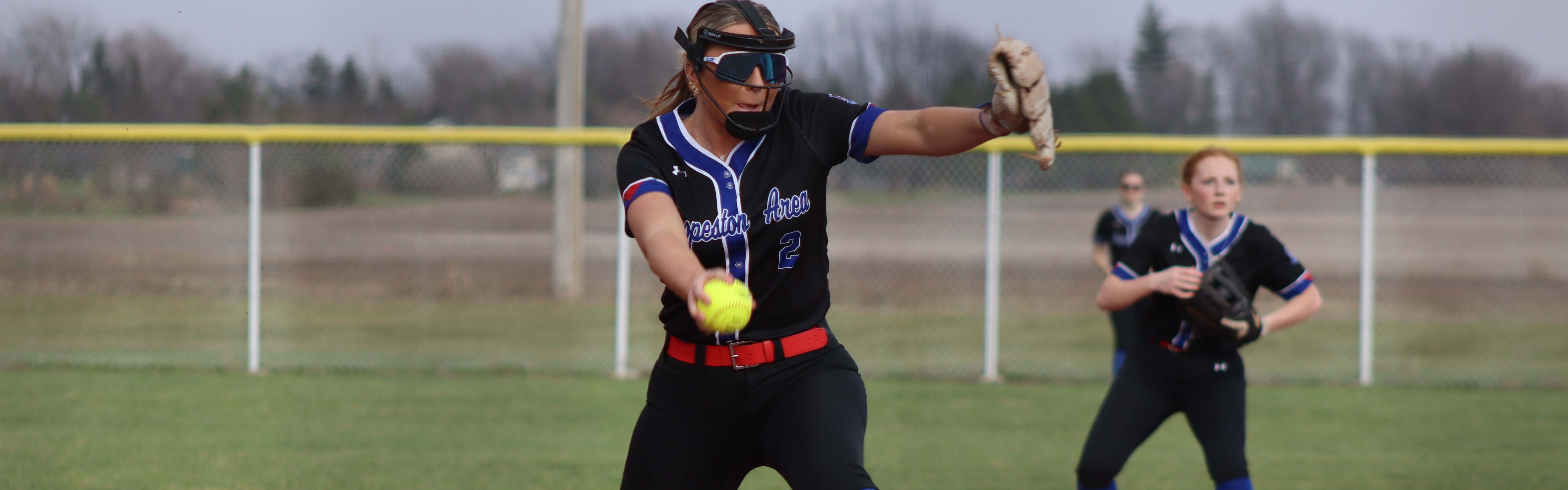 Wind-up for the pitch in softball.