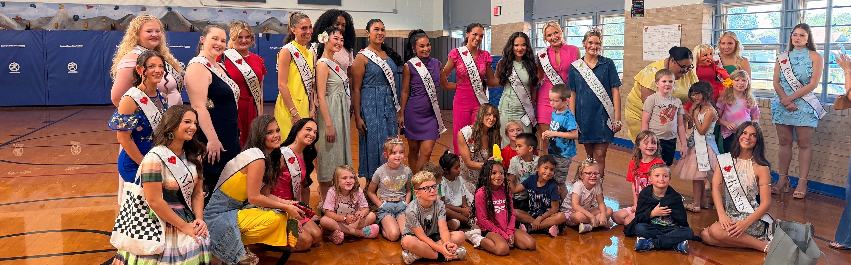 Queens visit Maple Grade school.
