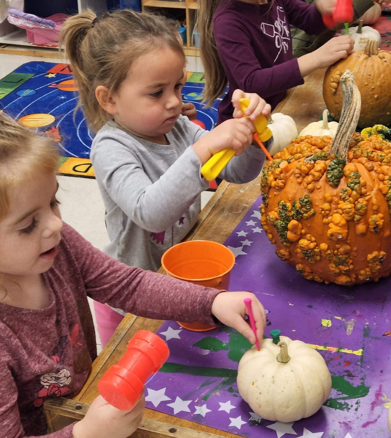 students with pumpkins