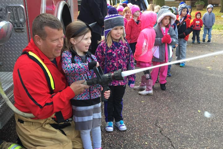 Firefighter and Jumpstart student