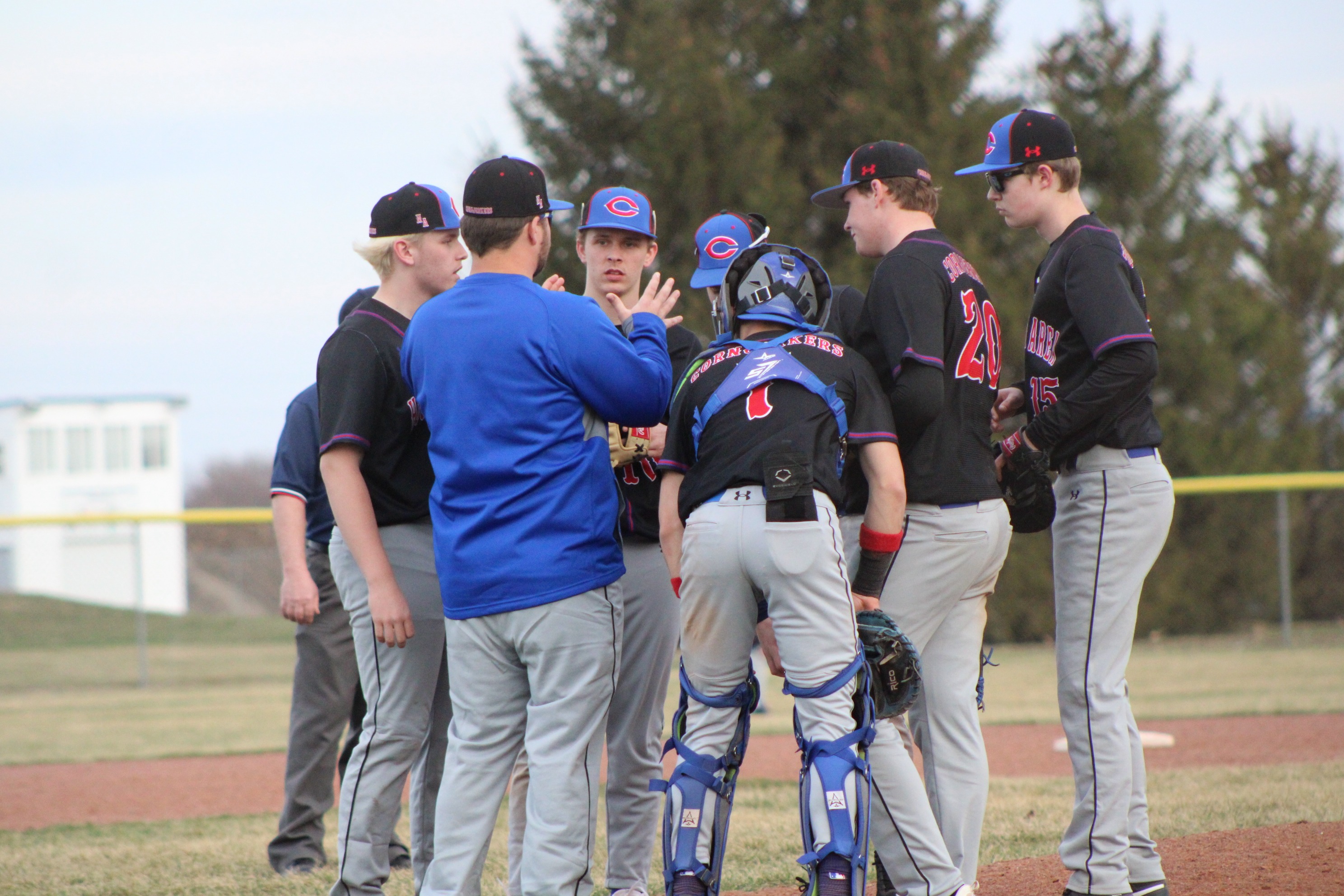 Coach Bouse talking to the infield