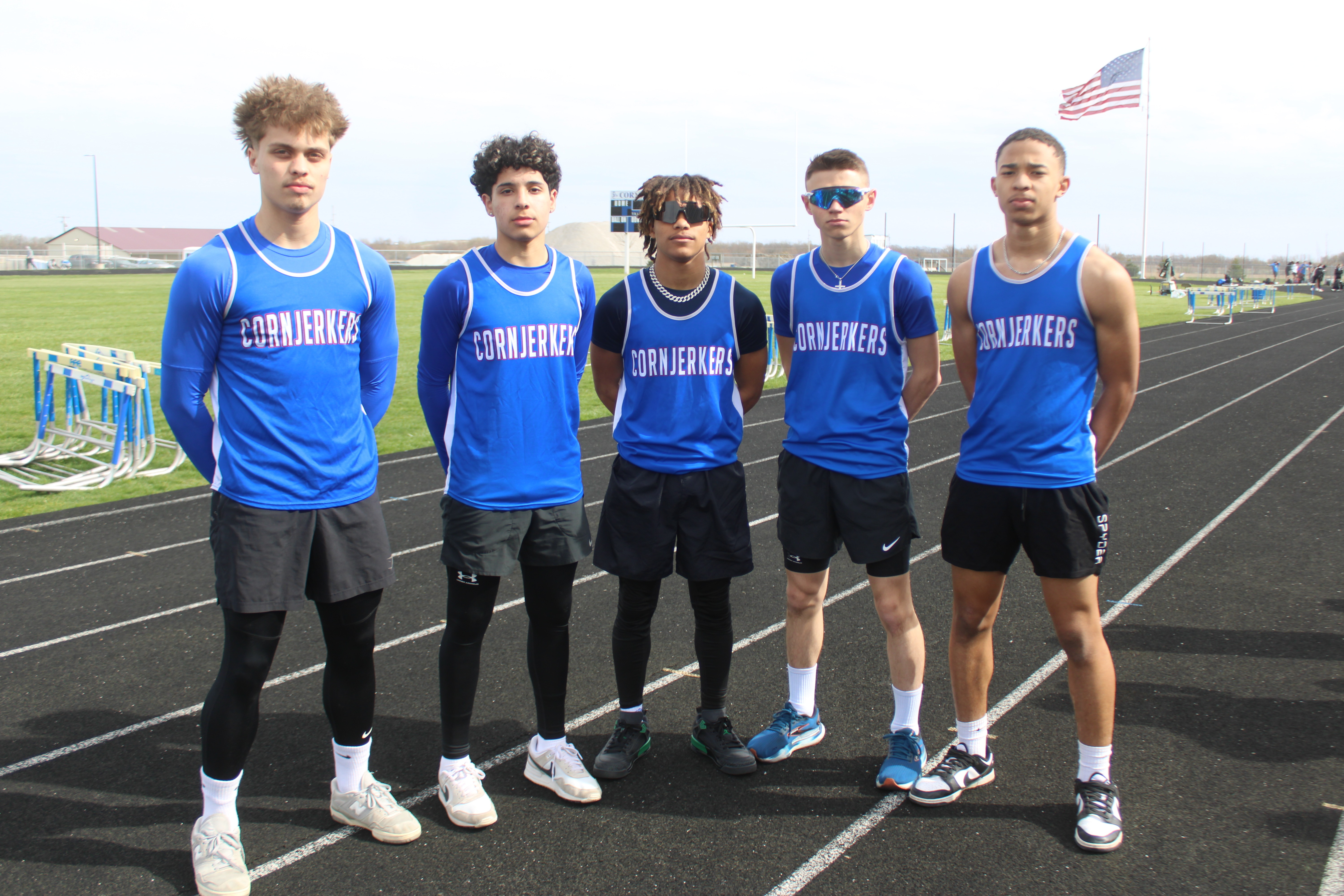 Track and field boys standing on the track