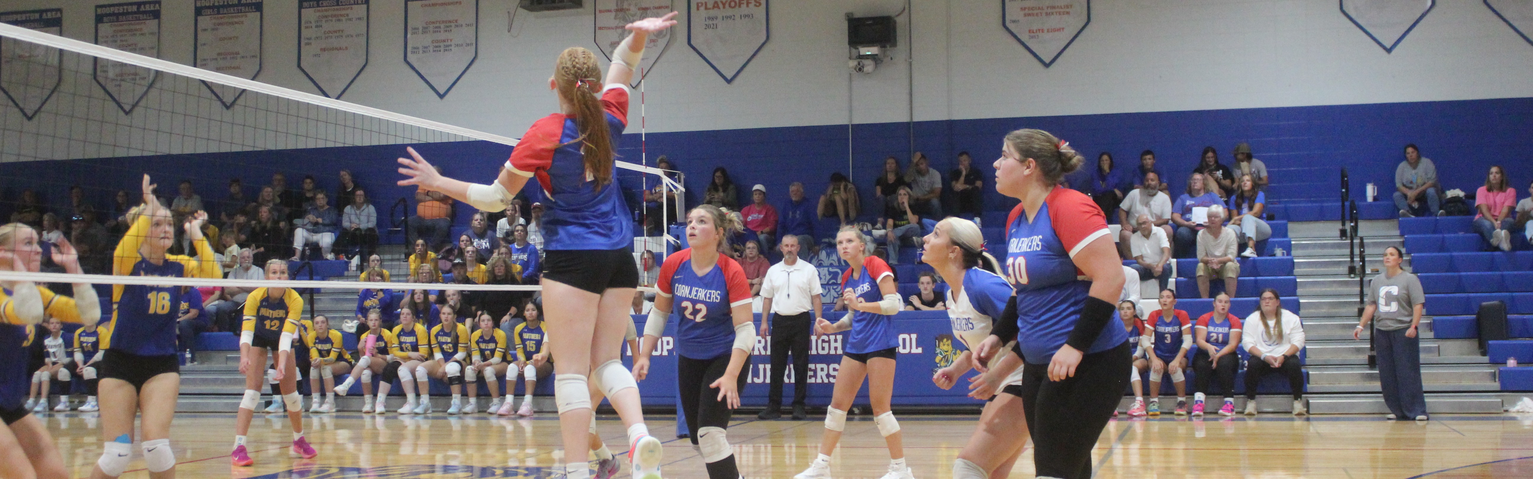 B vs. PBL spiking the ball.
