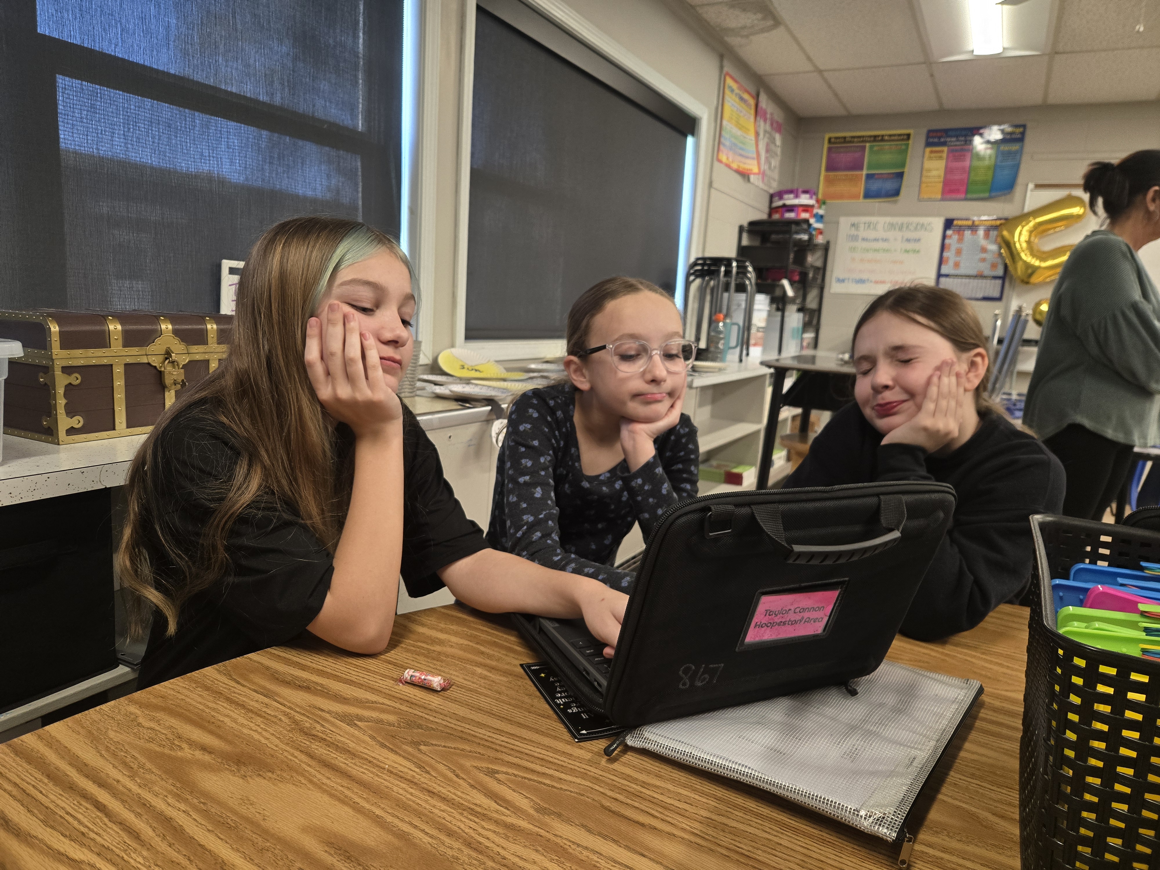 John Greer friends at a desk.