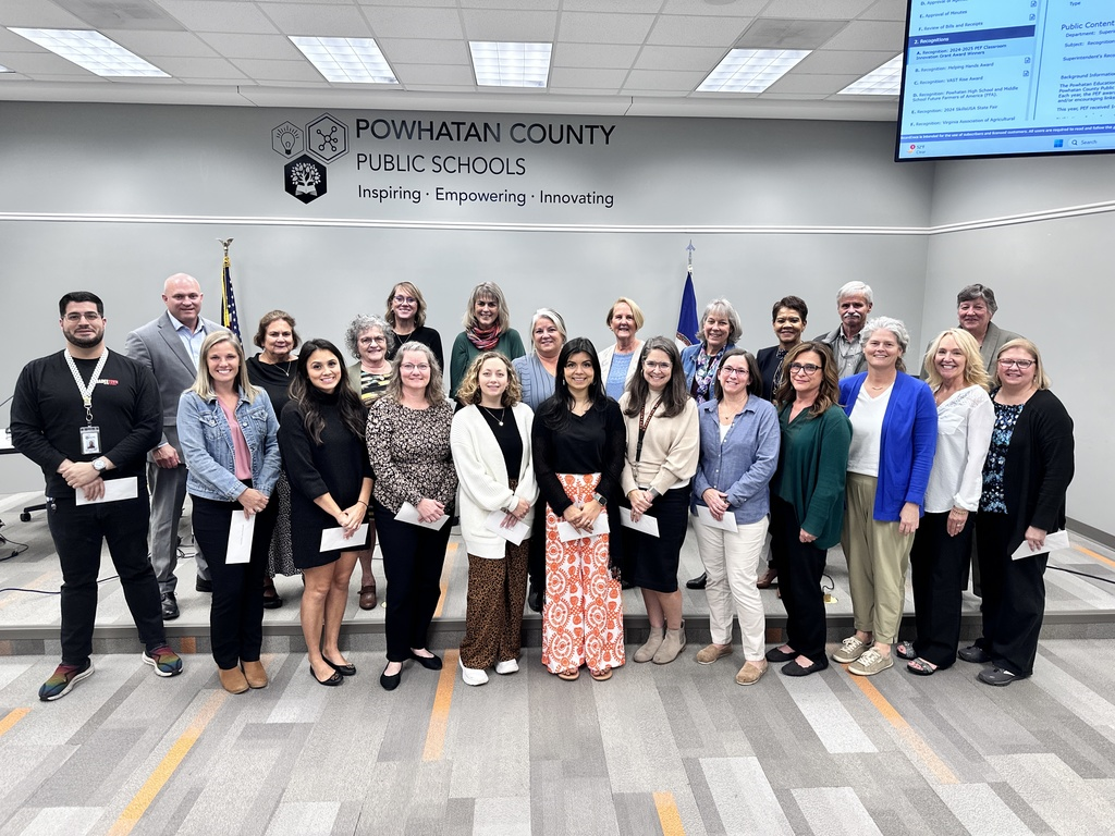 Teachers and Staff standing with School Board Member for recognition.