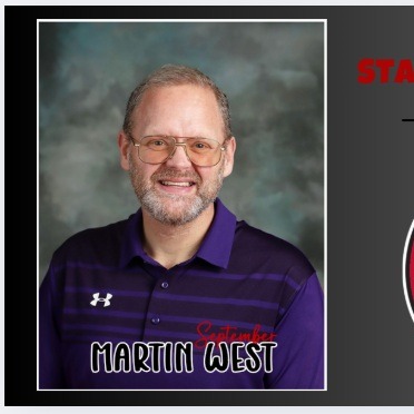 photo of teacher smiling in purple shirt