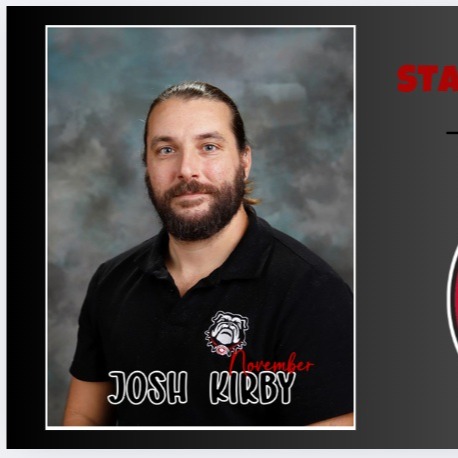 photo of male in polo shirt button up with beard smiling for staff of the month photo