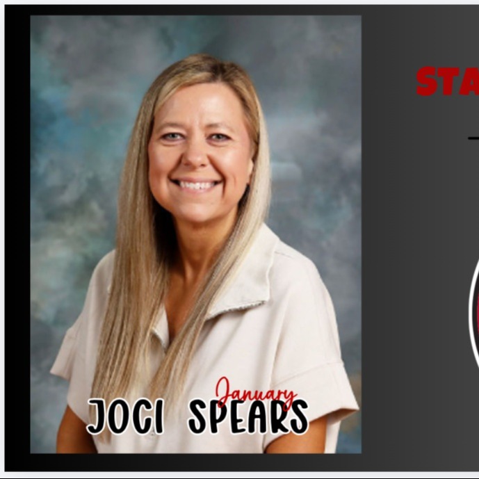 Teacher of the month smiling with blonde long hair in light tan collared shirt