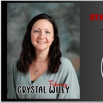 photo of female teacher in green v-neck shirt