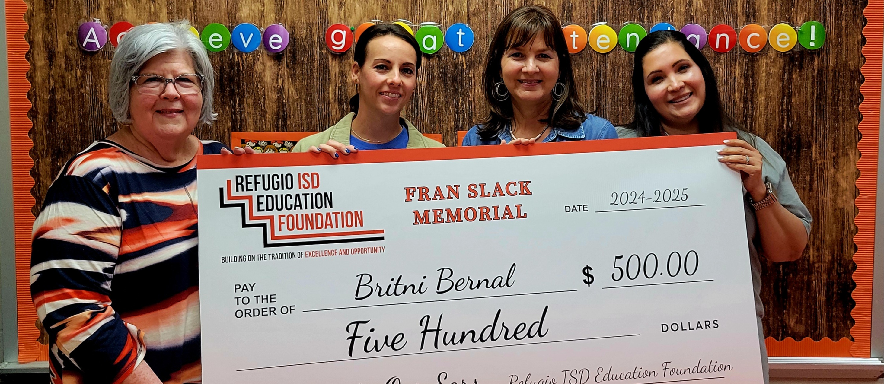 People holding a grant award check